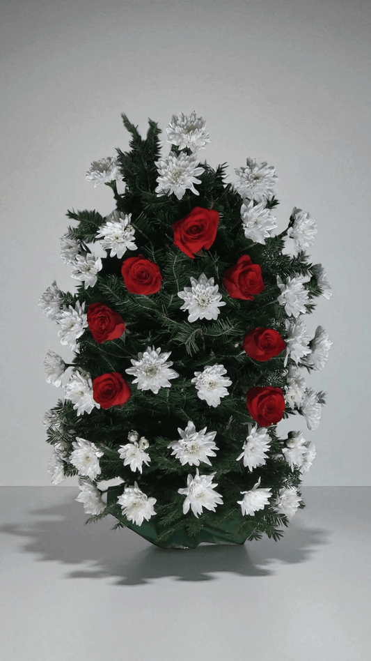 Jerba funerara din crizanteme albe si garoafe rosii pe mijloc

